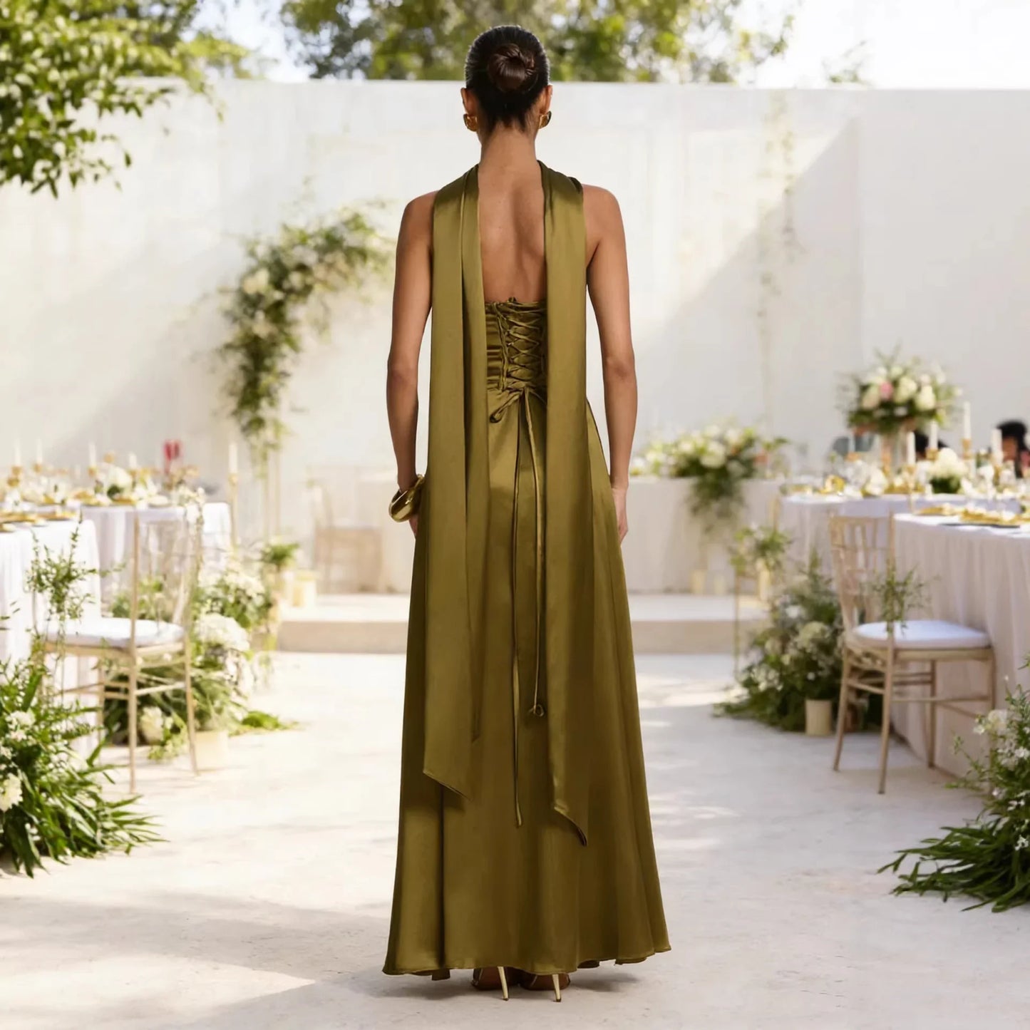 Olive green satin maxi dress with lace-up back and draped halter neckline, perfect for wedding guest or formal events