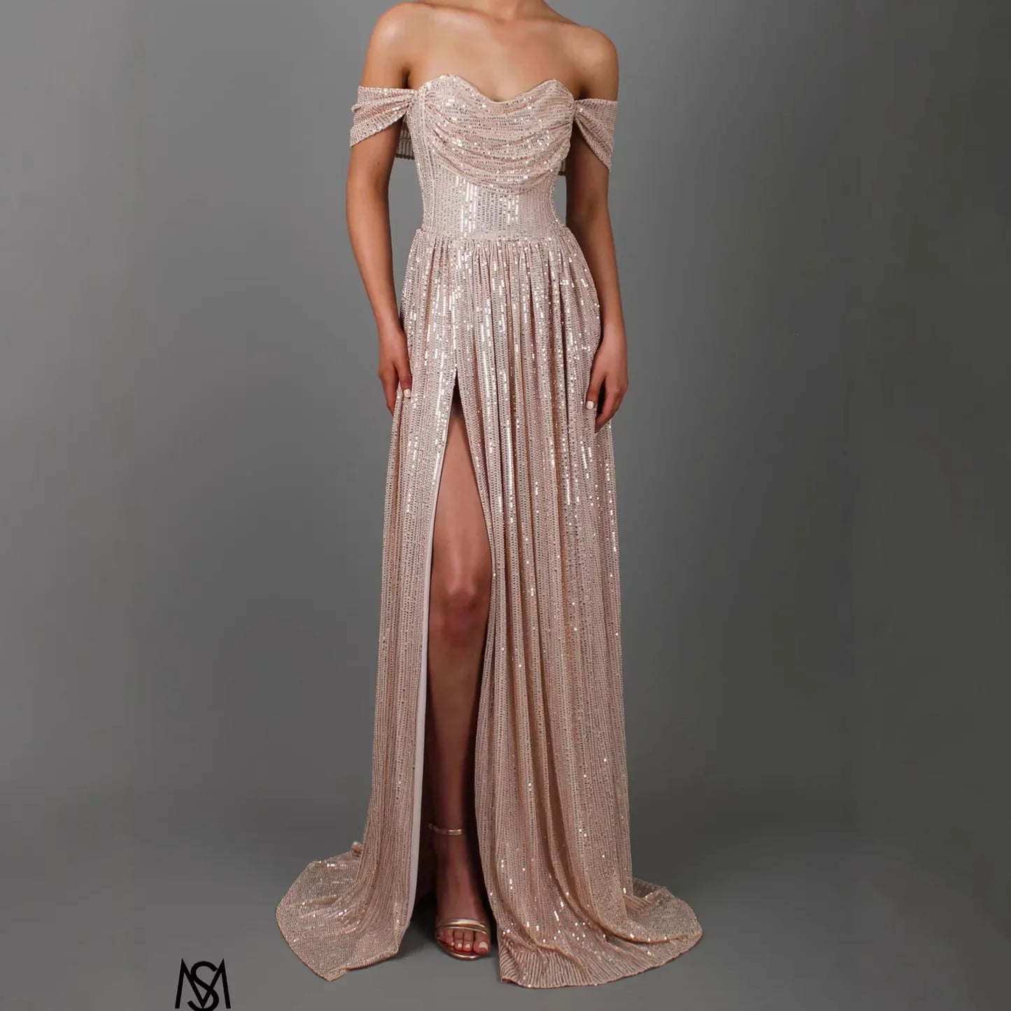 Champagne sequin off-shoulder evening gown with sweetheart neckline, high slit, and flowing train for formal events