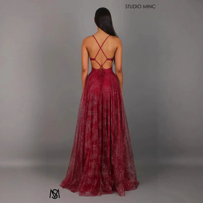 Burgundy glitter maxi dress with crisscross back straps and open back design, perfect for evening events