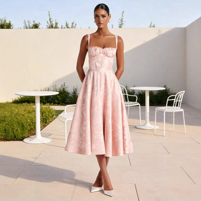 Pink floral jacquard midi dress with ruched bust and thin straps, styled for spring occasions