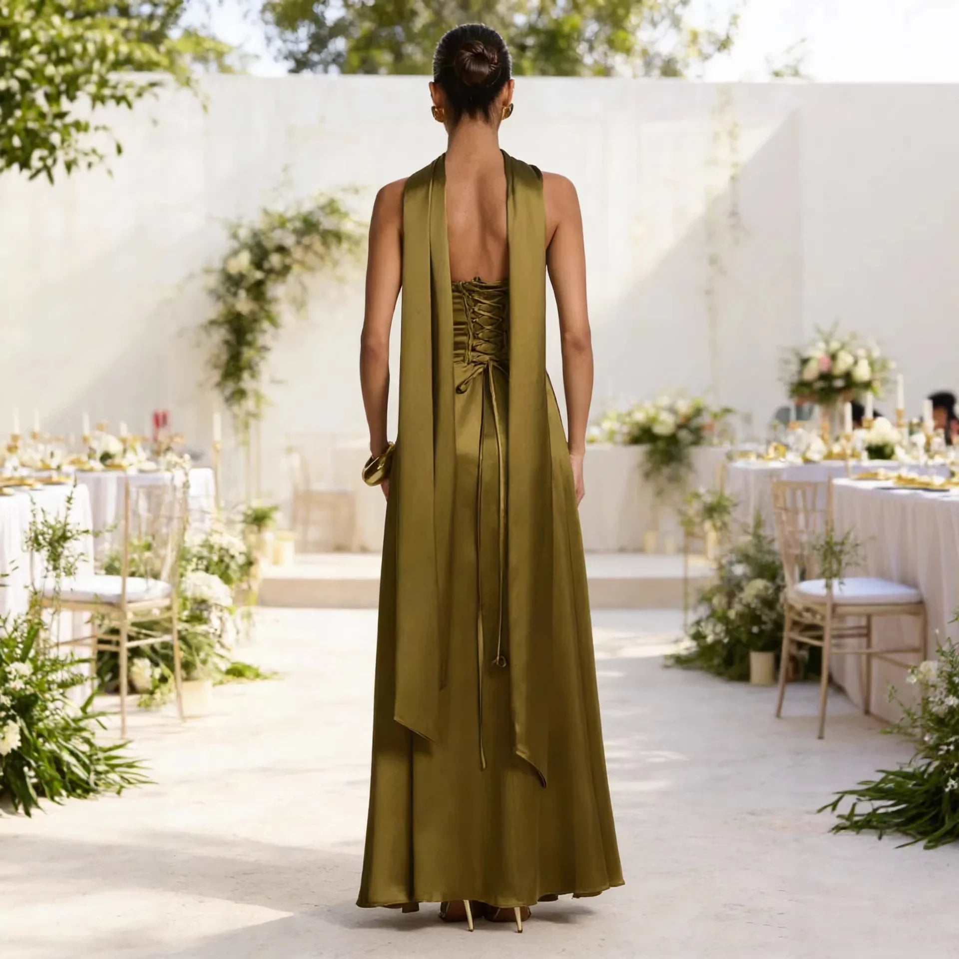 Olive green satin maxi dress with lace-up back and draped halter neckline, perfect for wedding guest or formal events