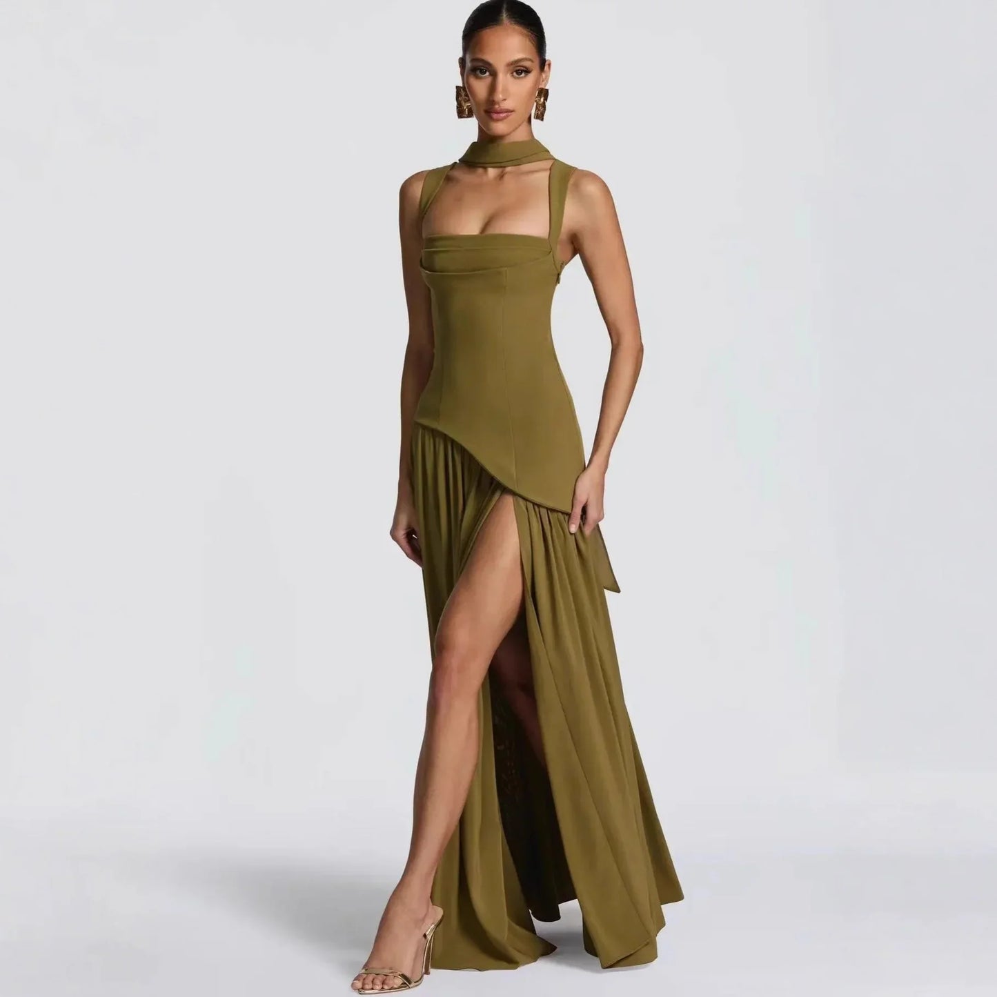Olive green evening gown with high slit, halter neck, and pleated skirt for formal events