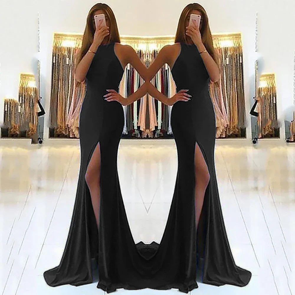 Black satin mermaid evening gown with high slit and halter neckline, perfect for formal events and prom
