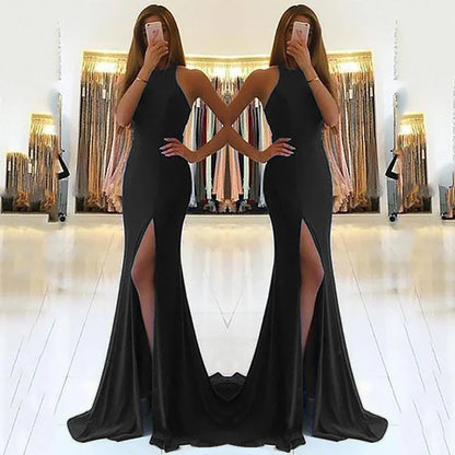 Black satin mermaid evening gown with high slit and halter neckline, perfect for formal events and prom