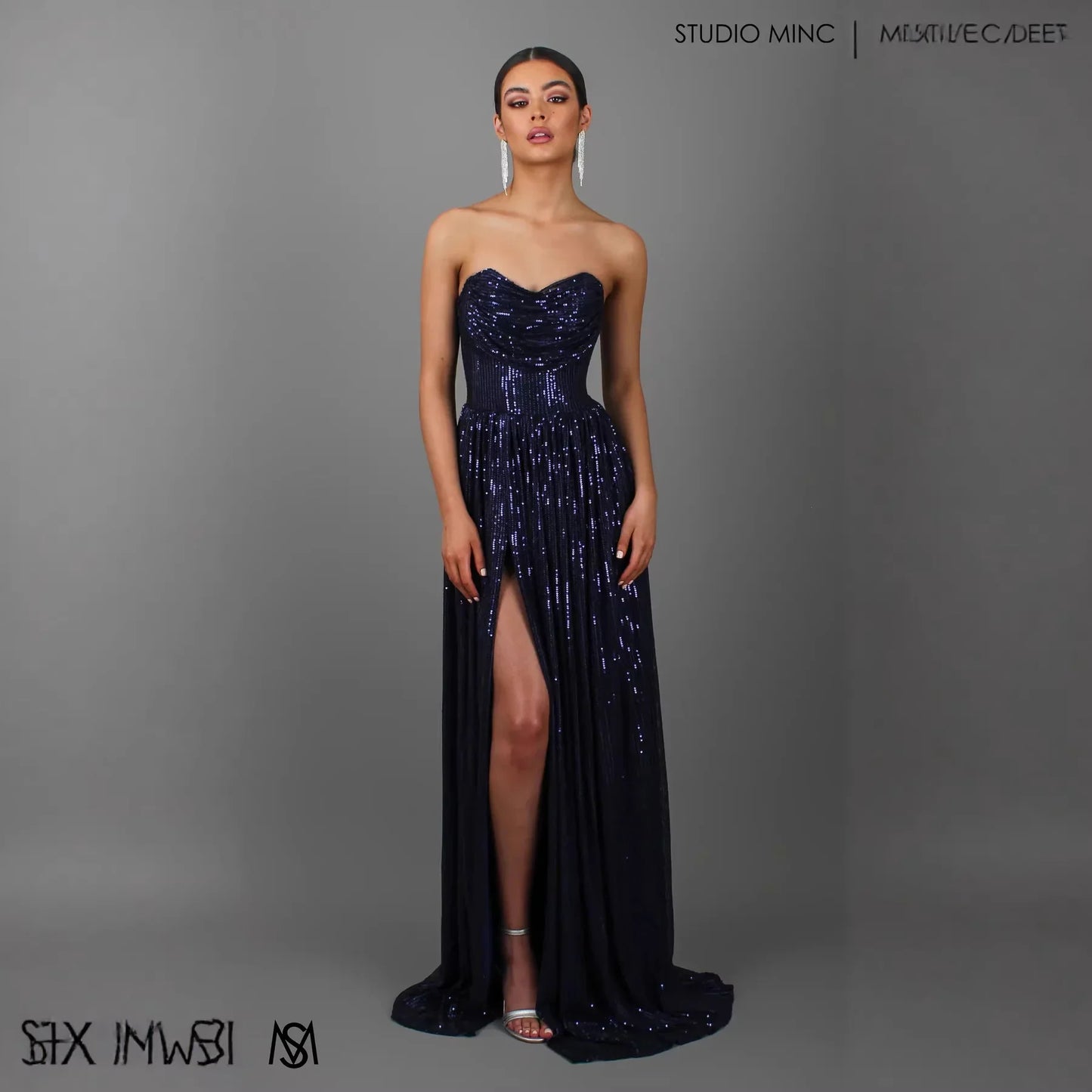 Navy blue sequin strapless evening gown with sweetheart neckline and high slit, perfect for formal events and proms