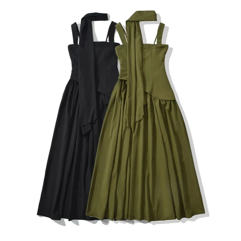 Black and olive green halter neck dresses with flowing skirts and tie-back details, ideal for elegant occasions.