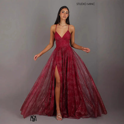 Burgundy glitter A-line prom dress with V-neck, spaghetti straps, and high slit, perfect for formal events and evening wear.