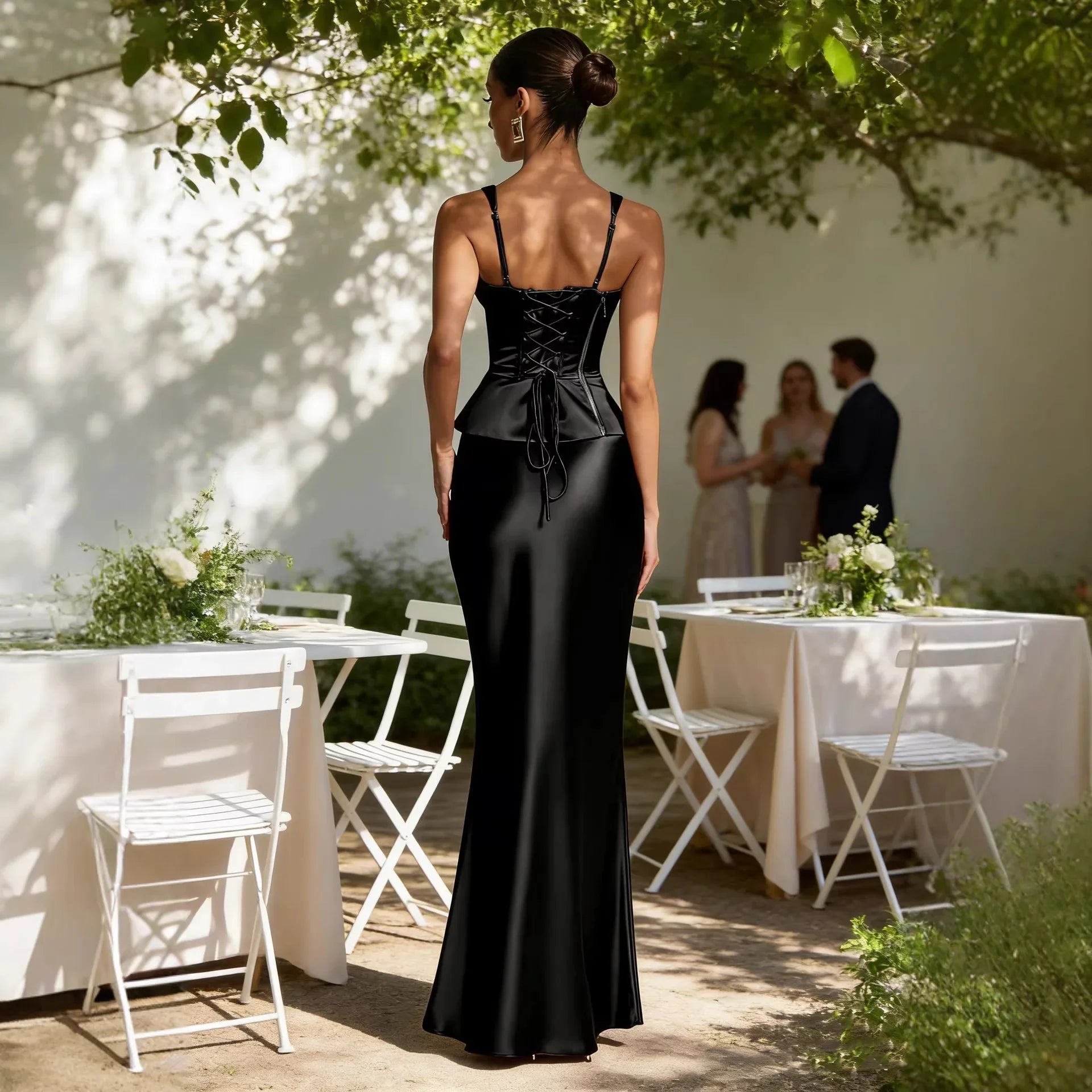 Black satin evening gown with lace-up corset back and spaghetti straps, perfect for formal events or weddings