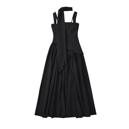 Black sleeveless midi dress with halter neck tie and flared skirt, ideal for evening or formal occasions