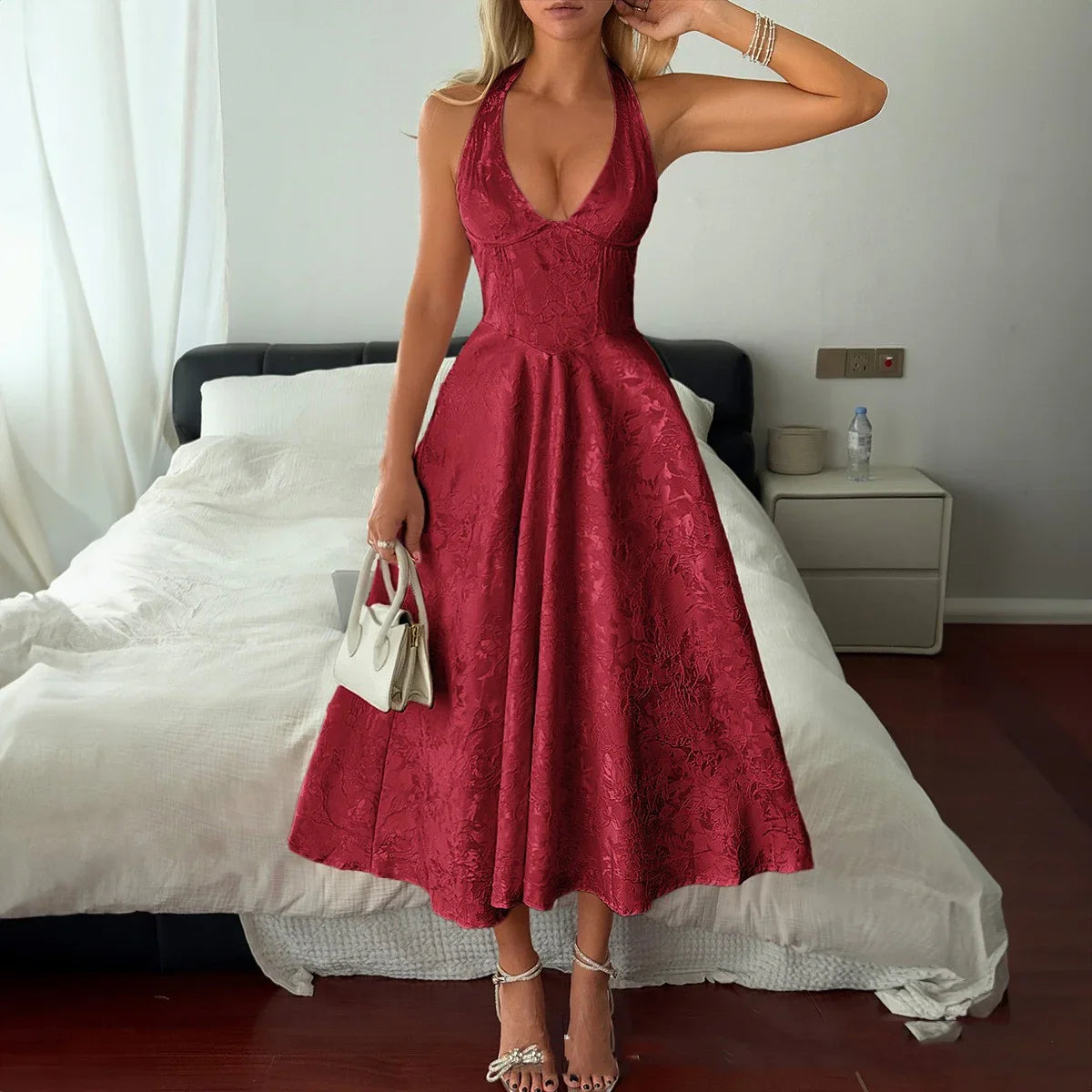Red lace halter neck midi dress with fitted bodice and flared skirt, perfect for evening events or formal occasions